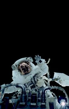 Space suits isolated on space background. Elements of this image furnished by Stock Photos
