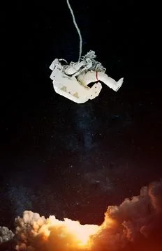 Space suits on space background. Elements of this image furnished by NASA. Stock Photos