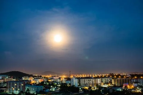 Space of super full moon on cloudy night sky and city, purple background. Stock Photos