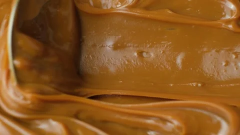 Space for text on boiled condensed milk texture or dulce de leche background Stock Footage 335228901