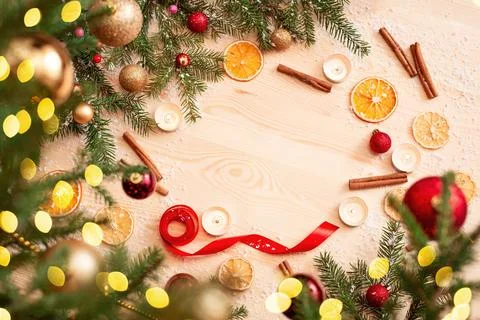 Space for text on light wooden table, christmas decoration as a frame Stock Photos