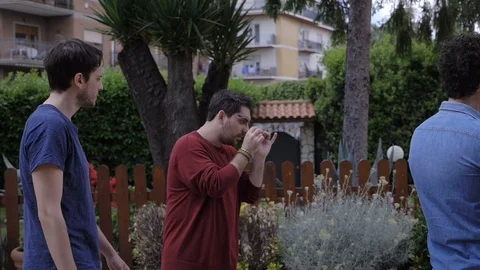 Space time concept. Young man walking among static people- slow motion Stock Footage 115533407