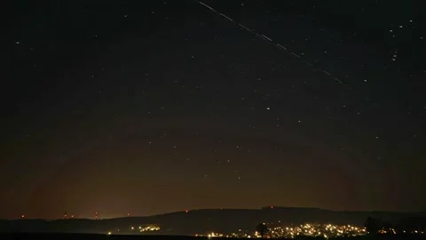 Space X Starlink Storm over small German town Time Lapse Stock Footage