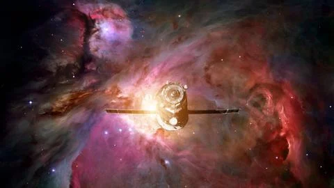 Spacecraft Progress orbiting the nebula. Stock Photos