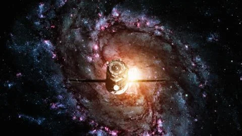 Spacecraft Progress orbiting the spiral galaxy. Stock Photos