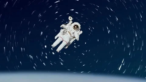 Spaceman Hovering Over Earth With Star Trails Sky Lapse Stock Footage 166959376