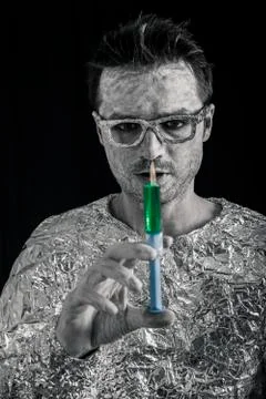 Spaceman with syringe Stock Photos