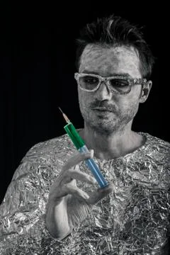 Spaceman with syringe Stock Photos