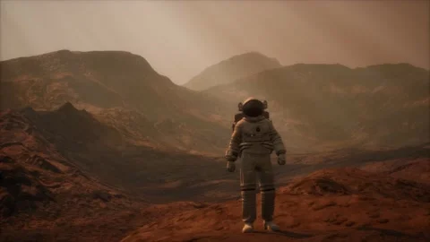 Spaceman walks on the red planet Mars. Space Mission Stock Footage 122331076