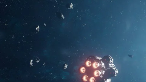 Spaceship travels through an asteroid field in outer space at night Stock Footage 344096734