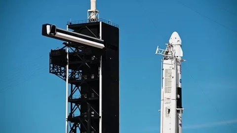 SpaceX access arm swinging into position for the crew of the Dragon spacecraft Stock Footage 289723443