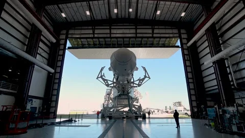 SpaceX Cargo Dragon spacecraft atop Falcon 9 rocket being rolled out for launch Video stock 289723435