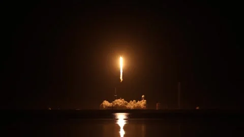 SpaceX Falcon 9 rocket carrying Crew Dragon Spacecraft launching from Kennedy Stock Footage 266894075