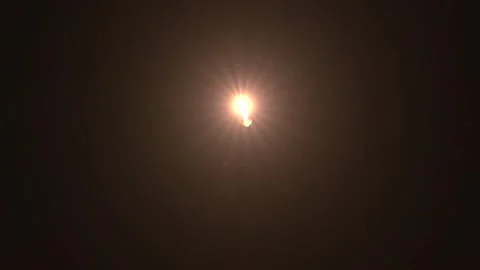 SpaceX Falcon 9 rocket entry burn 1st stage booster returning to earth Stock Footage 265459030