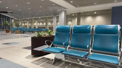 Spacious airport waiting area with empty chairs. 스톡 일러스트