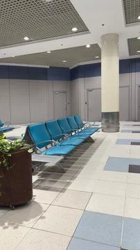 Spacious airport waiting area with empty chairs. 스톡 일러스트