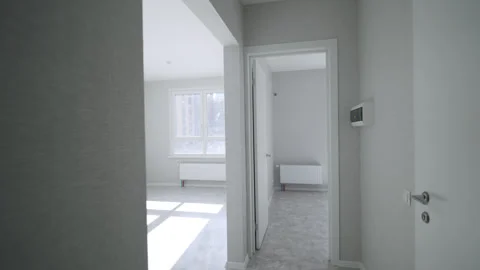 Spacious apartment interior designed in bright white tones Vídeos de archivo 330530132