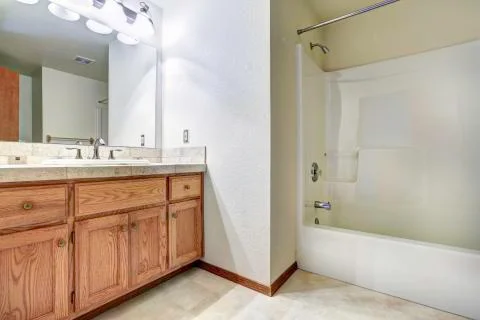 Spacious bathroom interior with bath tub Stock Photos