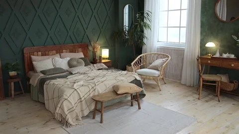 Spacious bedroom interior in boho style with green walls, wooden furniture Stock Footage 233764789
