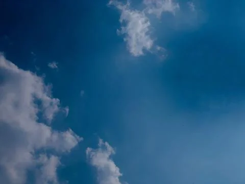 Spacious Blue Sky with White Clouds and Atmospheric Depth Stock Photos