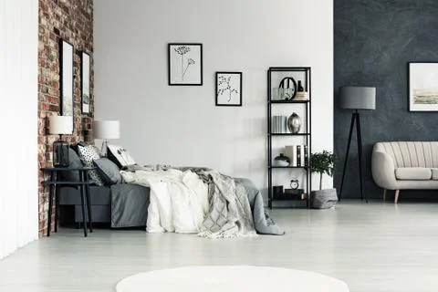 Spacious bright bedroom with drawings Stock-Fotos