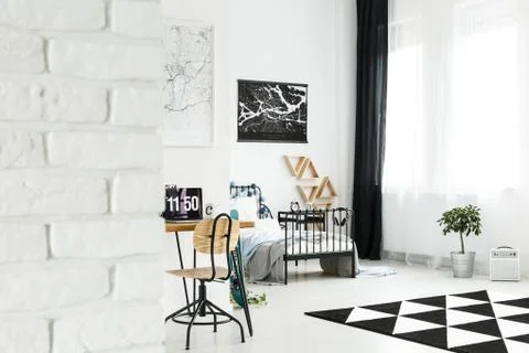 Spacious bright bedroom with workspace Stock Photos
