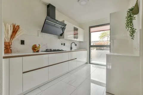 Spacious bright kitchen with dining area Stock Photos