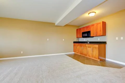 Spacious dining area with kitchen cabinets. Stock Photos