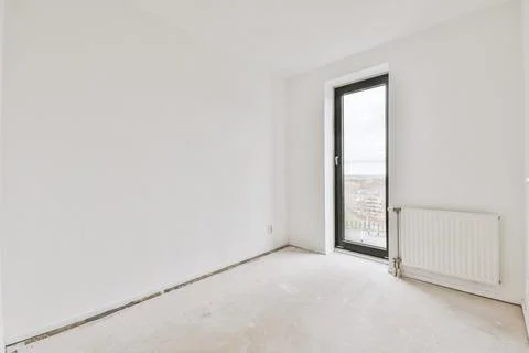 A spacious, empty, bright room in white tones Stock Photos