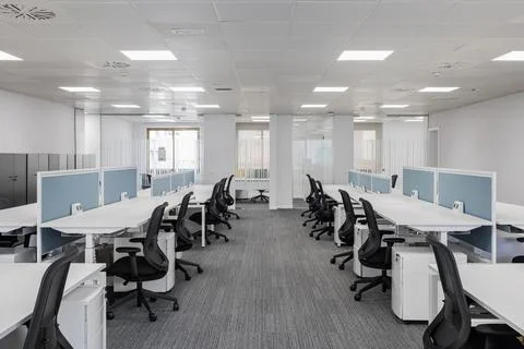 Spacious empty office in gray colors with comfortable office furniture without Photos