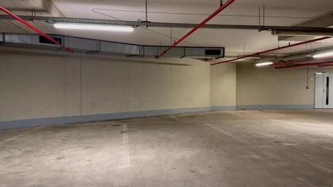 A spacious empty parking garage highlighting its vastness and architectural.. Stock Photos