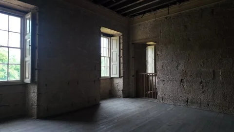 Spacious Empty Room With Bare Stone Walls And Wooden Floor Awaiting Renovation Stock Footage 339926259