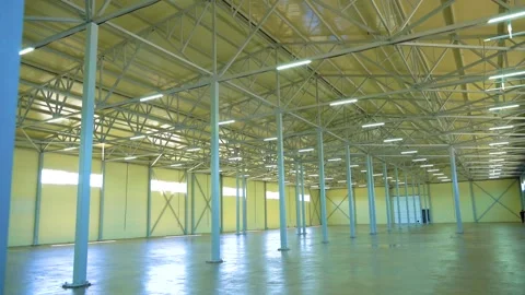 Spacious Empty Warehouse Interior With Steel Columns and High Ceiling Stock Footage 340041852
