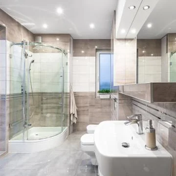 Spacious high-gloss bathroom Stock Photos