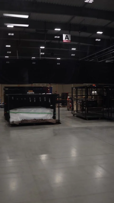 A spacious industrial hall with metal structures and storage equipment arranged  Stock Footage 294707781