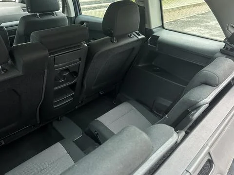Spacious interior of a modern vehicle showcasing folded seats perfect for t.. Stock Photos