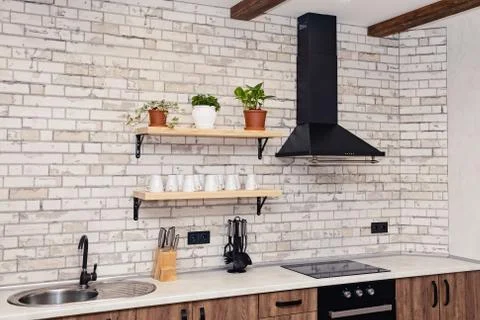 Spacious kitchen in rustic style Stock Photos