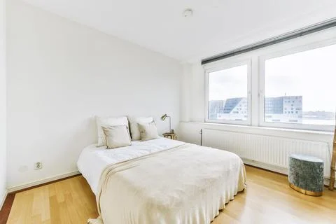 Spacious light bedroom at home Stock Photos