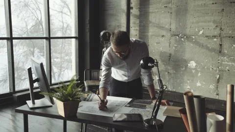 A spacious light office in loft style with panoramic windows. Stock Photos
