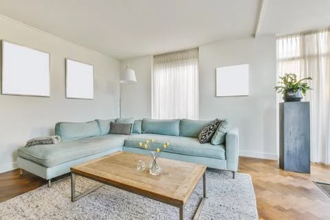 Spacious living room with couch Stock Photos