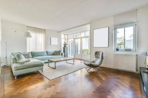 Spacious living room with couch Stock Photos