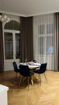 Spacious living room with a small table for dinner Stock Photos