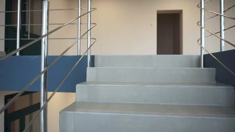 Spacious lobby of a new modern office building. A flight of stairs Stock Footage 287095557