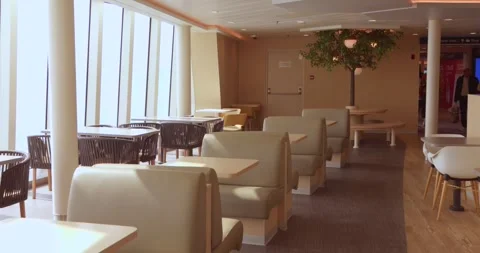Spacious Modern Ferry Lounge Interior with Seating and Large Windows, Dover to Stock Footage 339643736