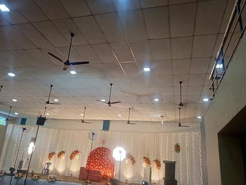 Spacious Modern Hall Interior with Ceiling Fans Фото