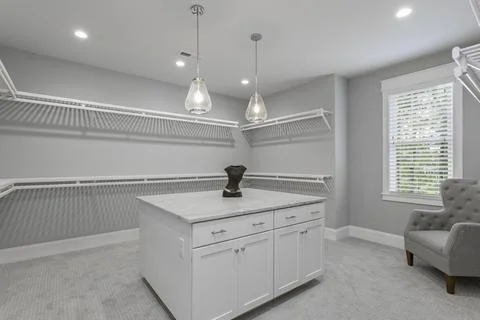 Spacious Modern Walk-In Closet With Ample Shelving And Stylish, Minimalist .. Stock Photos