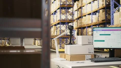 Spacious organized warehouse with empty shelves and open supply room Stock Photos