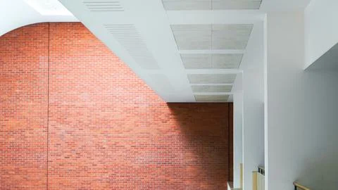Spacious public interior with bright white architectural walls and details Stock Photos