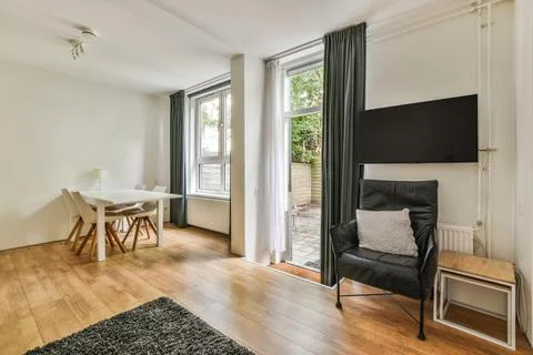 Spacious room with various areas Stock Photos