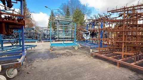 A spacious storage area filled with various types of metal racks and essent.. Stock Photos